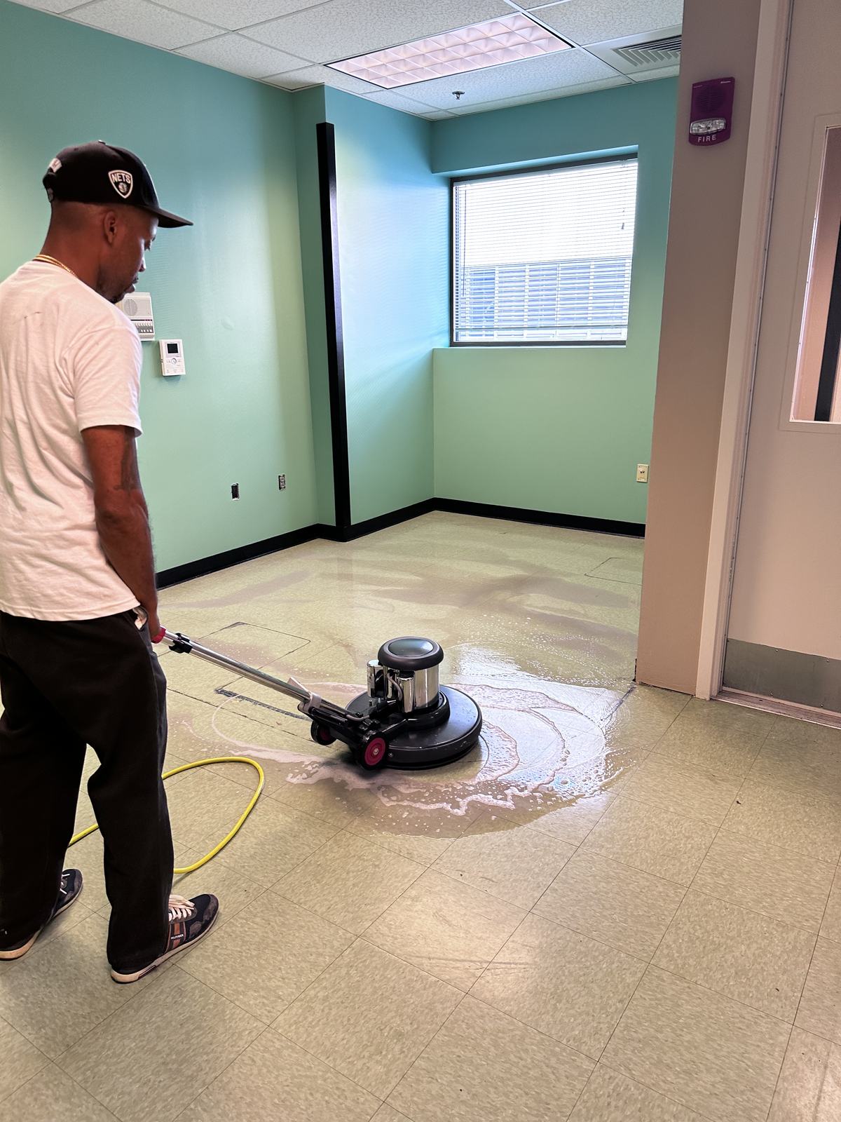 TPS Pro crew member buffing commercial floors