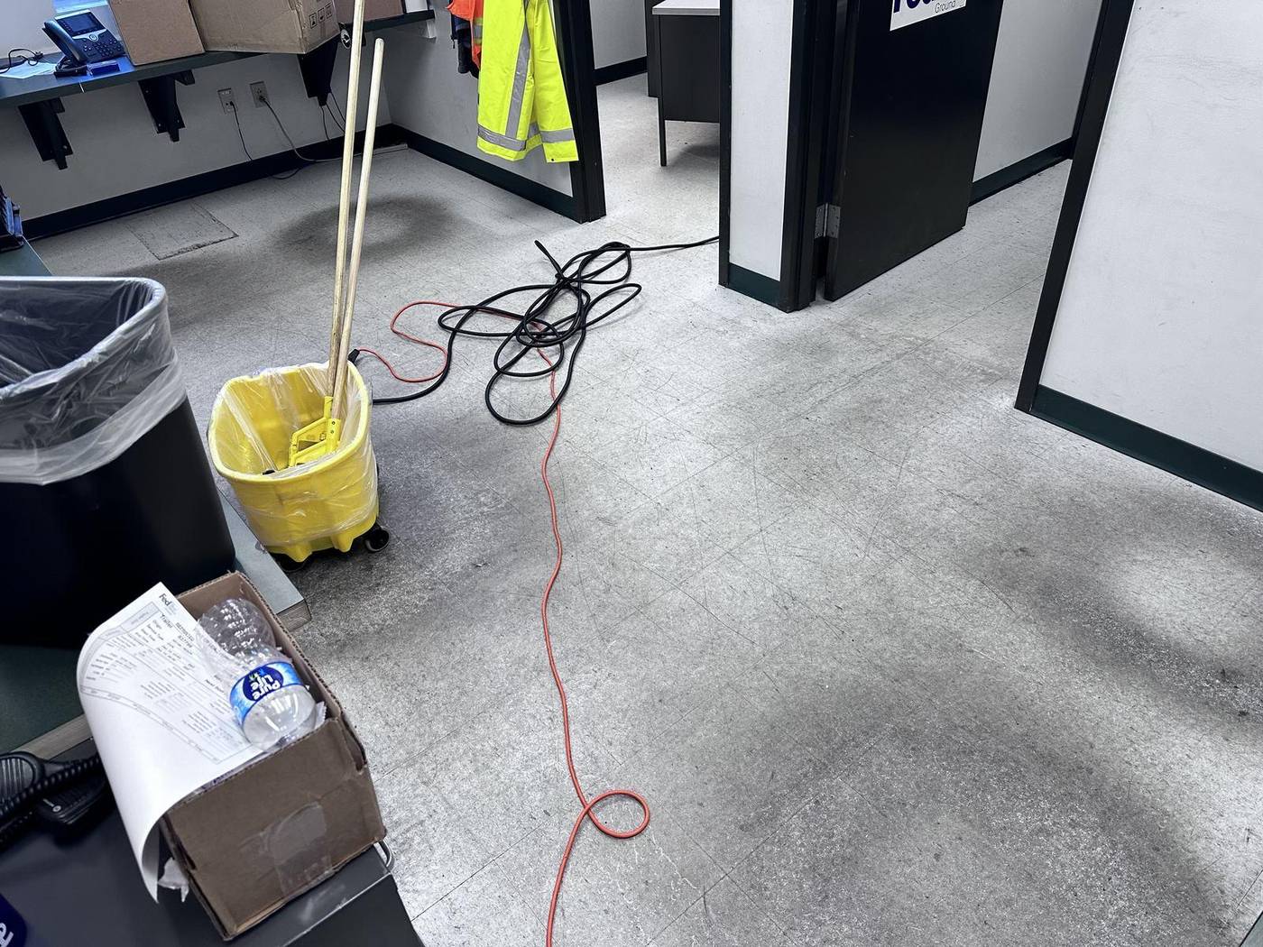 Janitorial crew cleaning an office